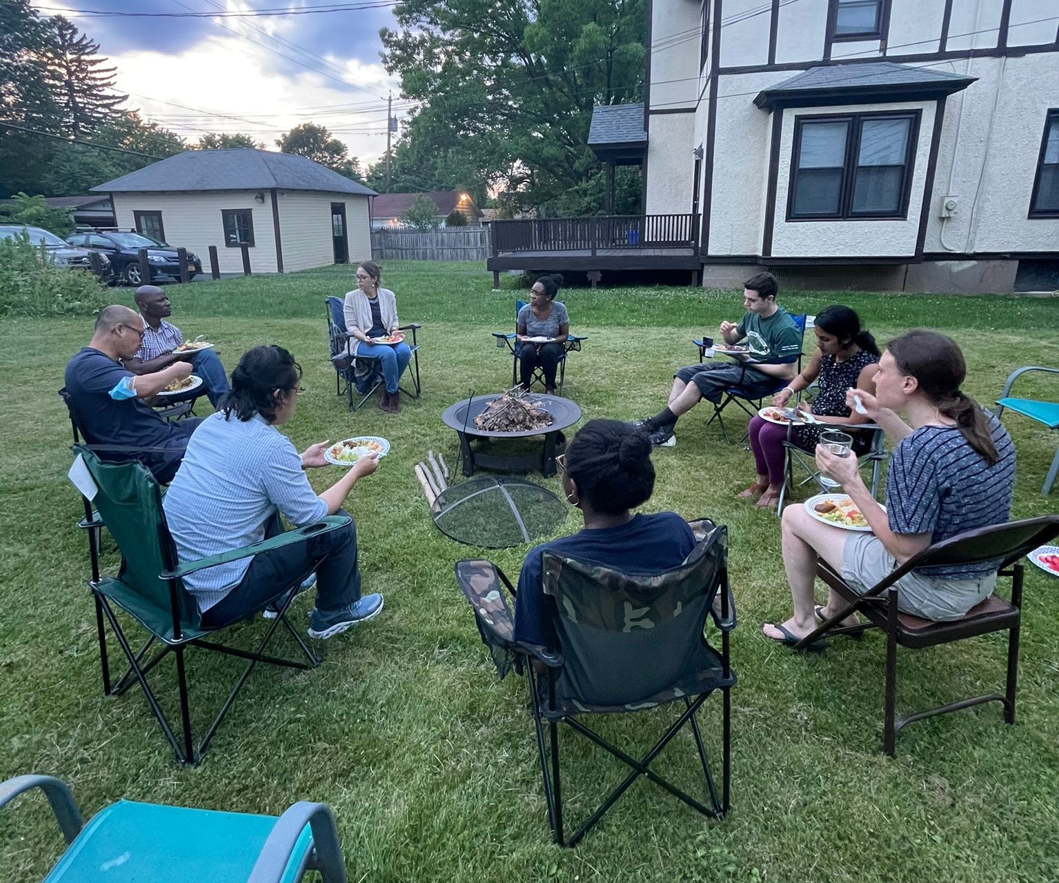 Young adults having fellowship meal after Bible study